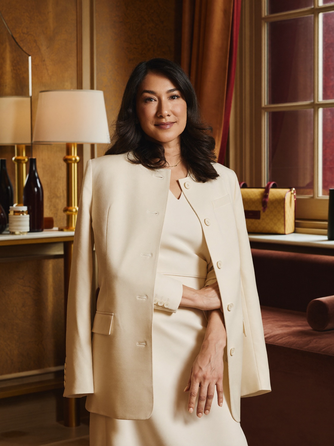 Dr. Elena Reyes, a warm, board-certified woman facial plastic surgeon, in her boutique consultation room