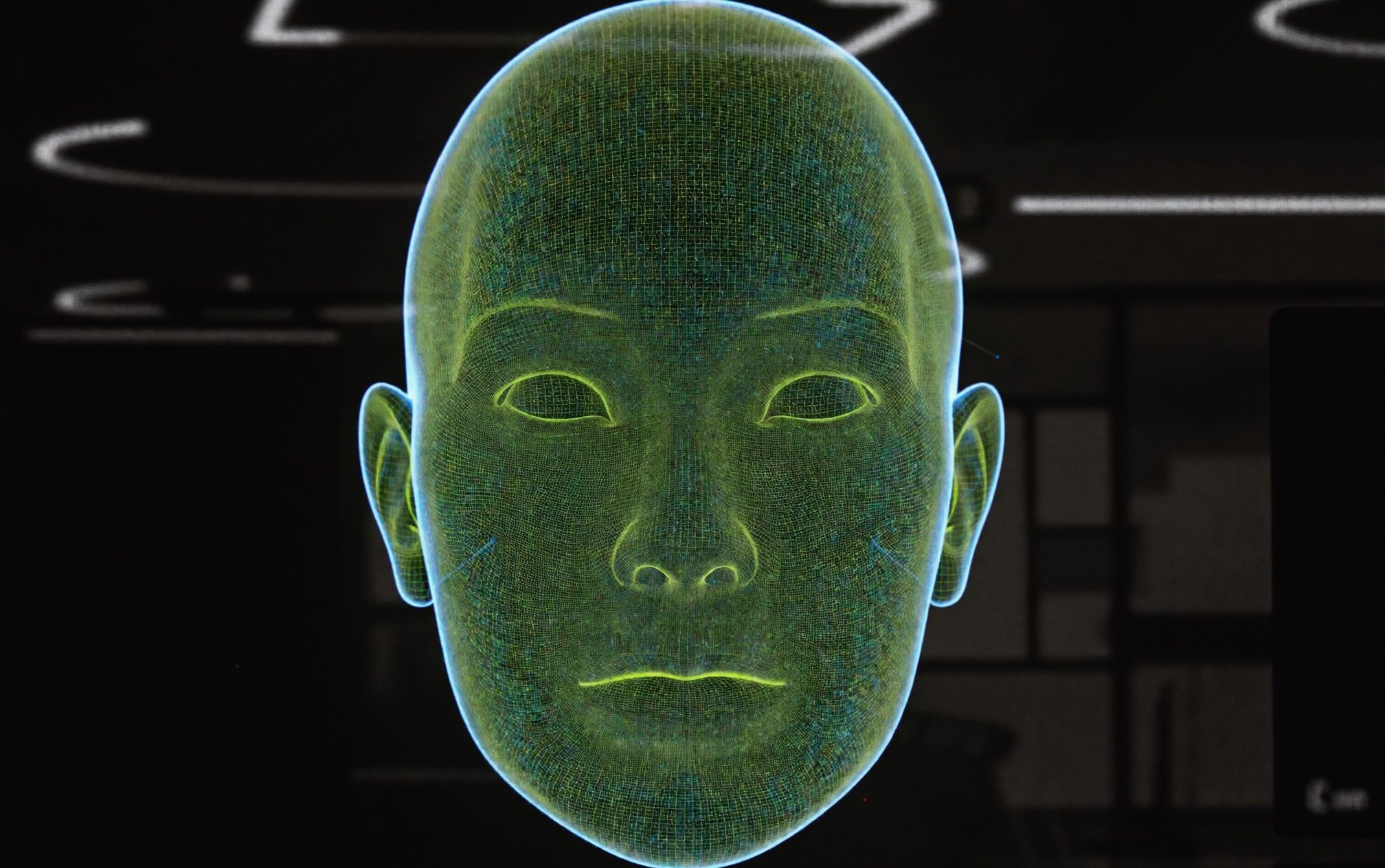 A 3D facial simulation interface showing a translucent wireframe face render with lime-green contour lines on a dark clinic screen