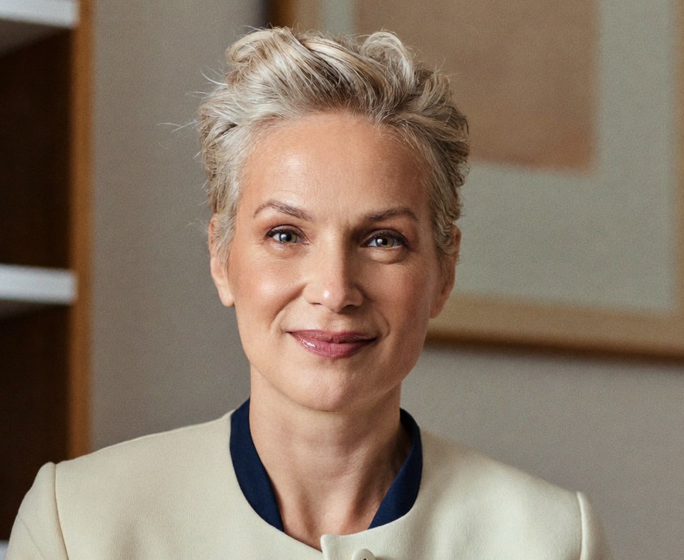 Dr. Élise Marchand, double board-certified facial plastic surgeon, in her consultation office.
